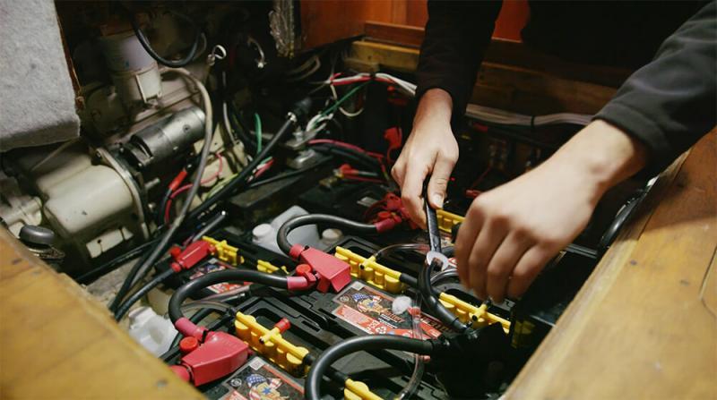 Man Fixing Batteries
